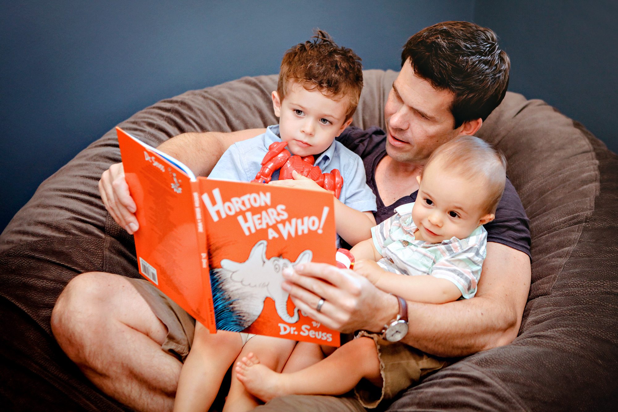 Reading a book in cozy setting.