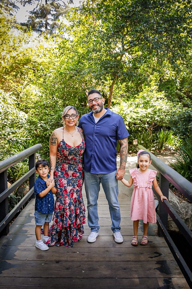Family-Holiday-Portrait-Session-Descanso-Gardens Family posing on a wooden bridge at Descanso Garden