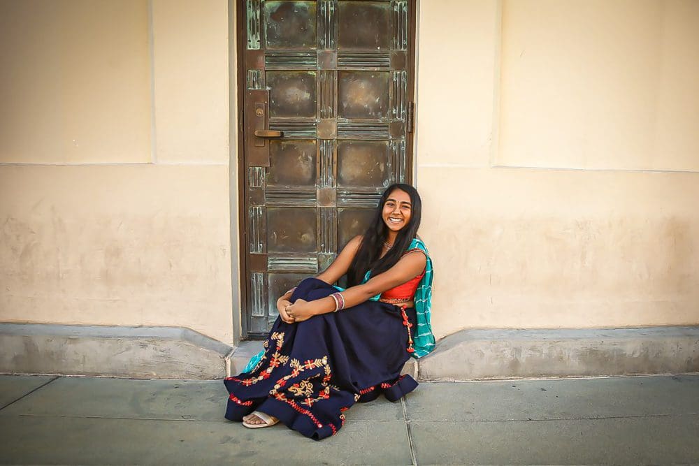 Teenage Girl in traditional Indian attire by door at Griffith Park Observatory.