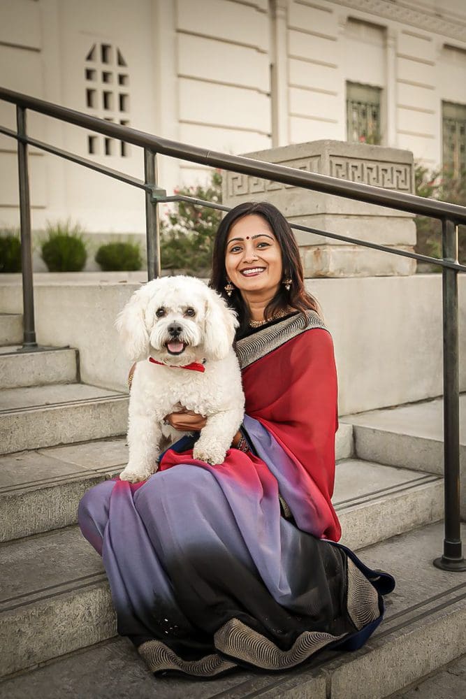 Holiday-Family-Portrait Session-Griffith Observatory-021 Woman in saree holding white dog.