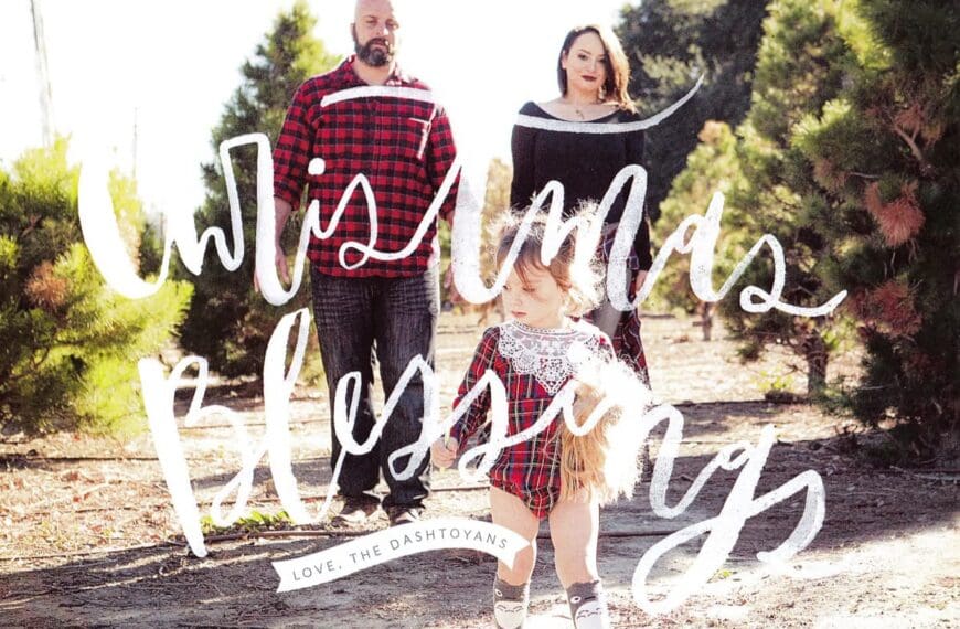 Family portrait in festive attire outdoors at a christmas tree farm during a holiday family portrait session