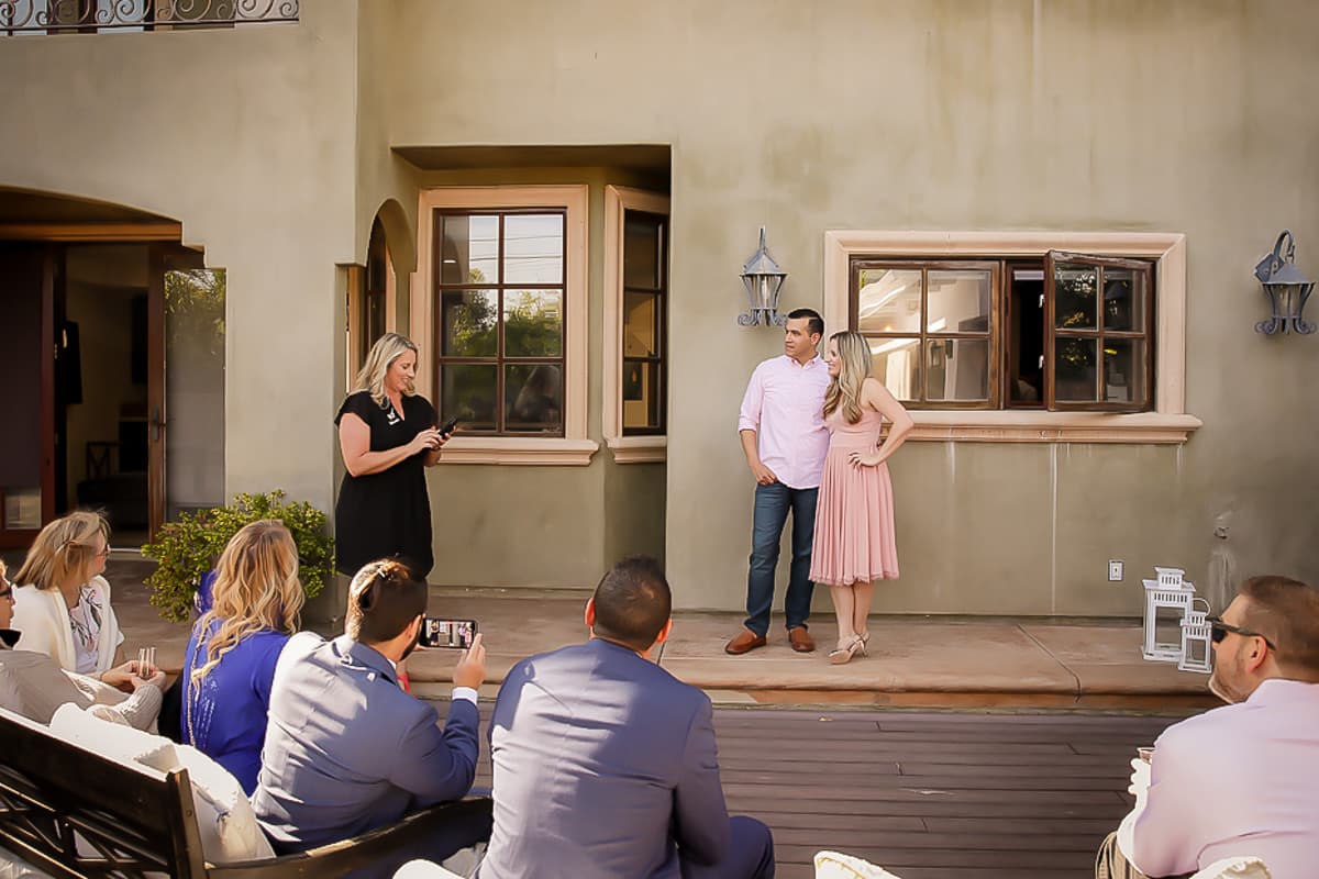 Couple celebrating anniversary with guests.