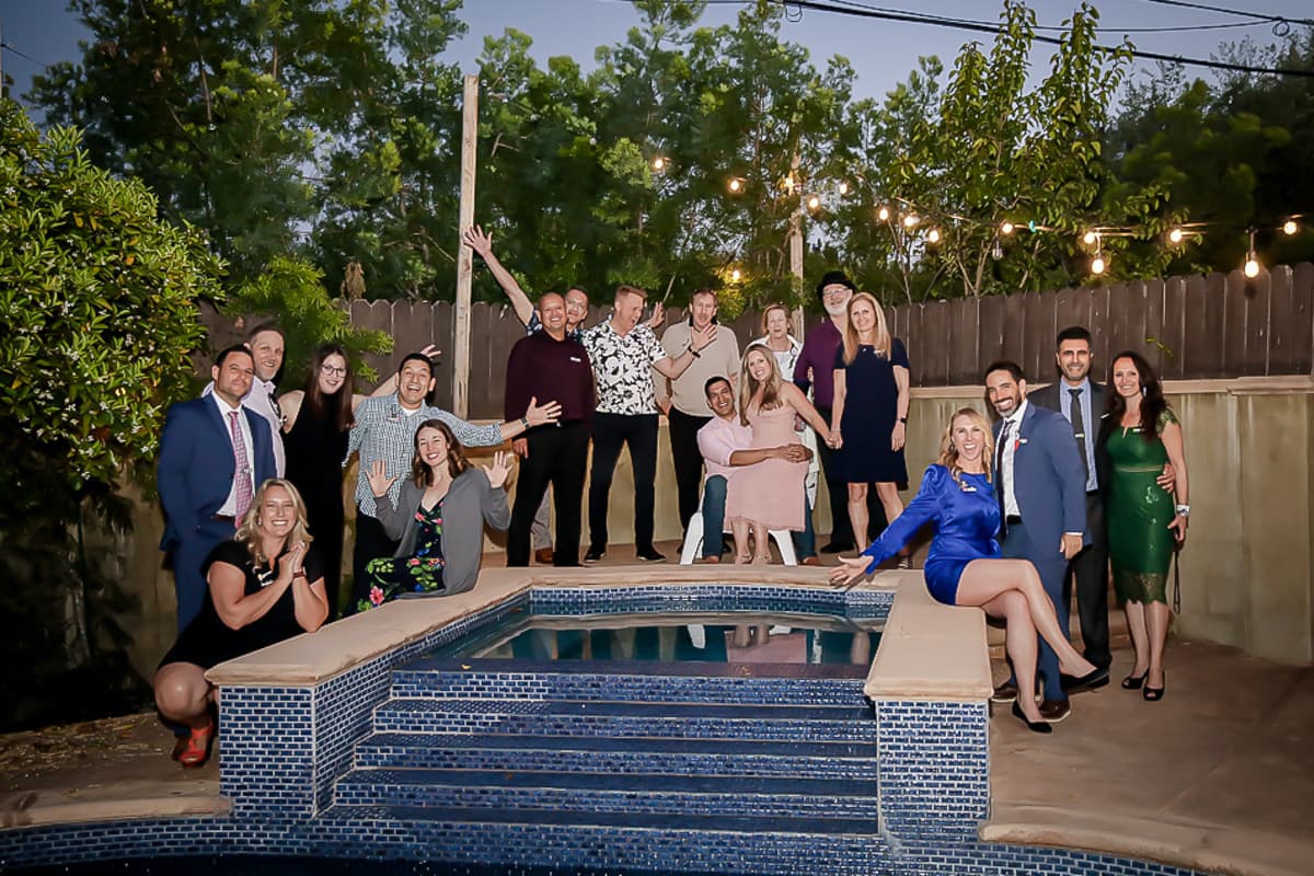 Group celebration by the poolside.